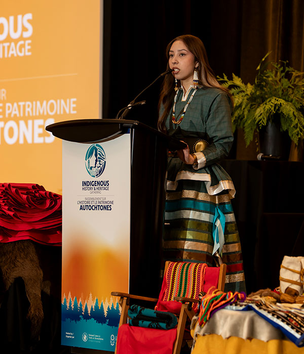 Woman standing at IHHG podium
