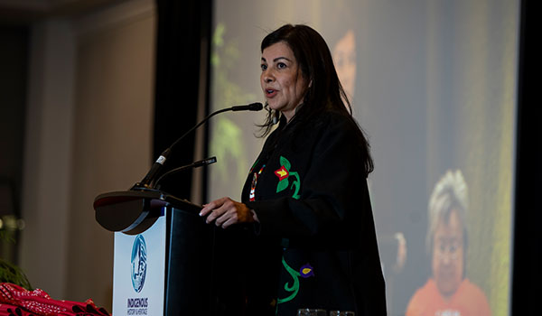 Woman speaking at IHHG 2026